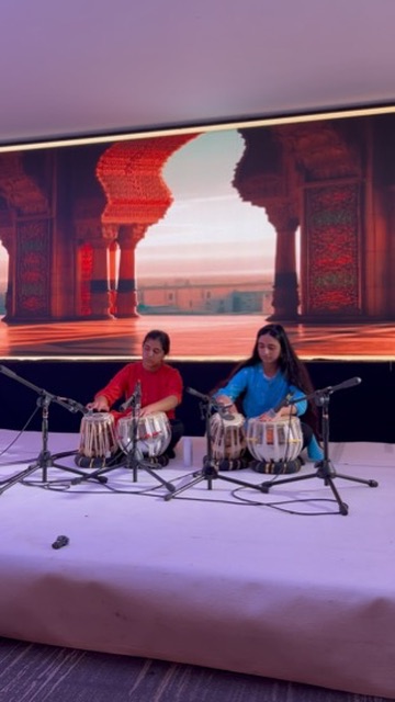 Two Taal Music Academy students performing tabla as a duet