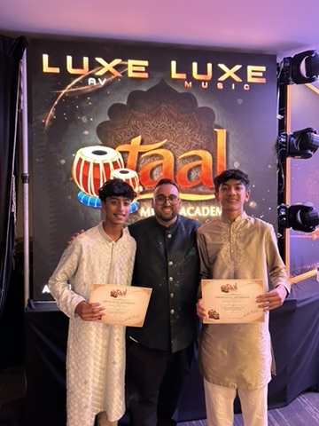 Sachin Khetani with two students holding their performance certificates