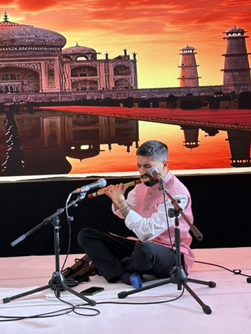 A solo tabla performance under stage lighting